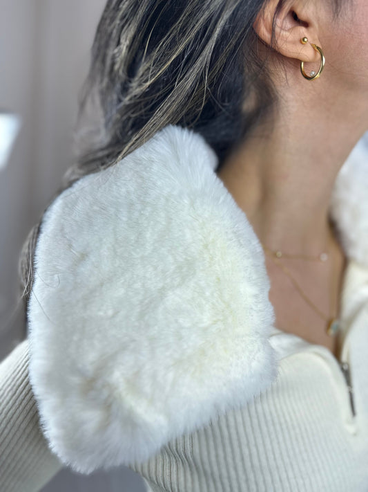 Fur neck sweater.