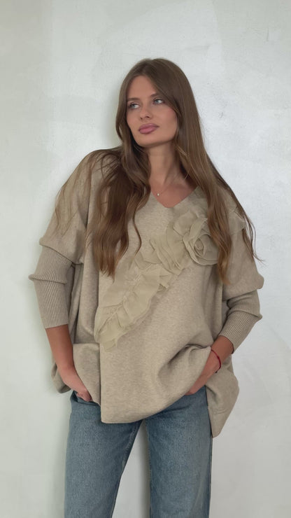 Sweater with flared sleeves and ruffles