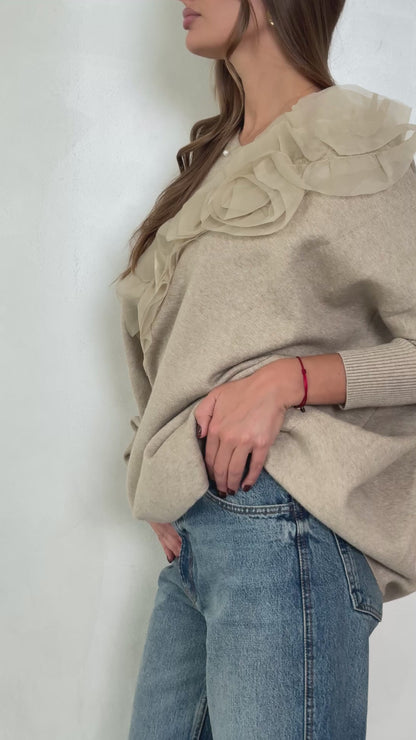 Sweater with flared sleeves and ruffles