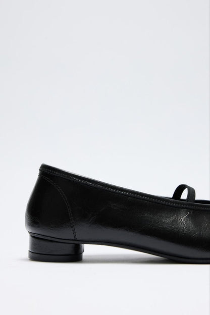 Soft leather kitten heel shoes.